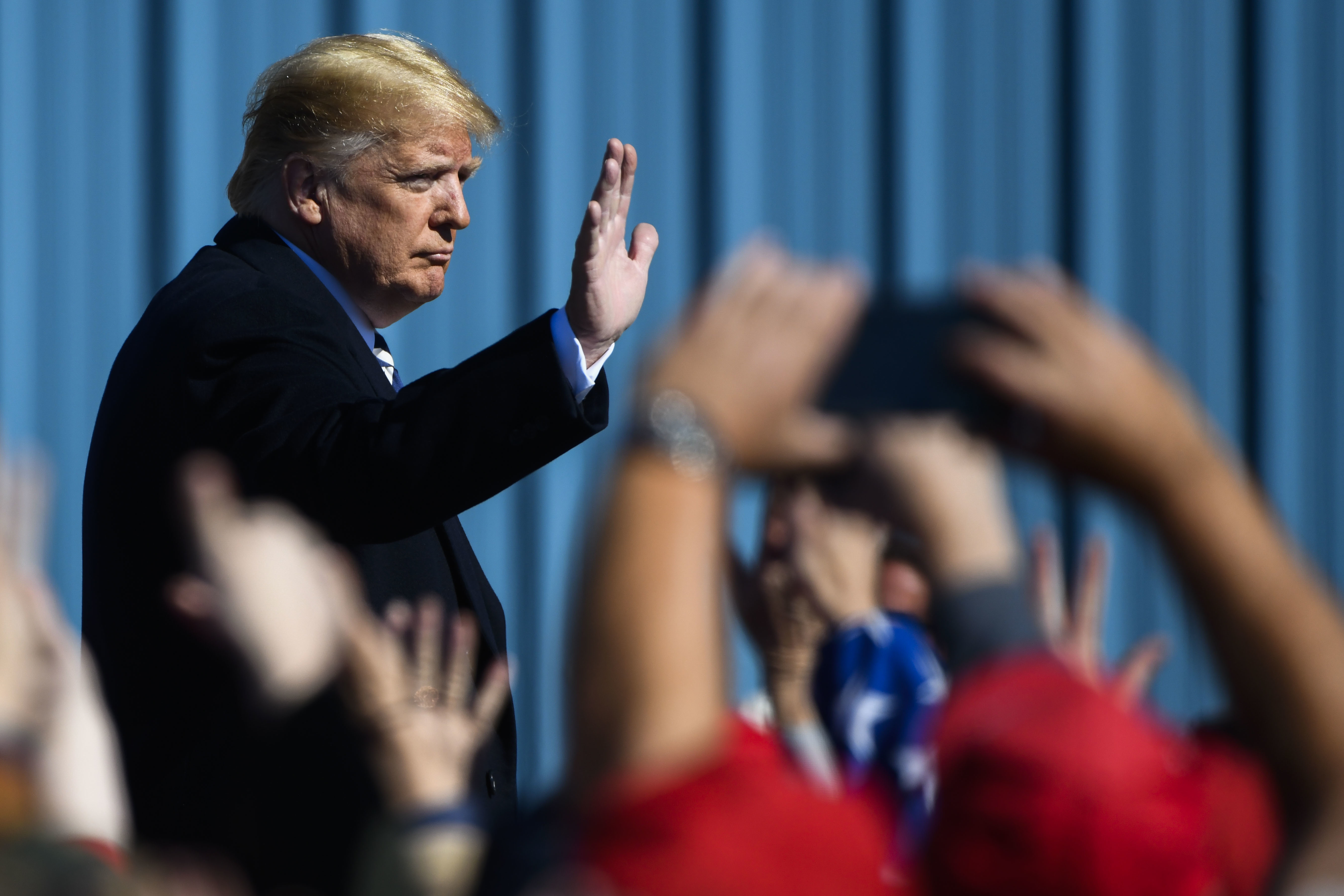 Man waves to crowd