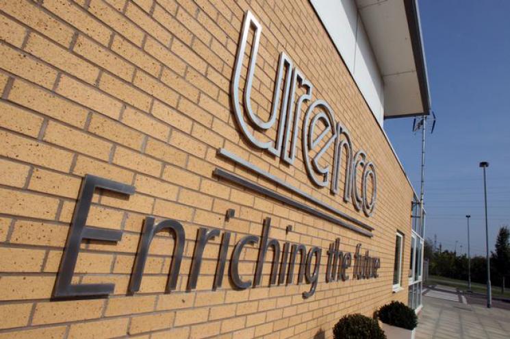 The exterior of the URENCO building in Amsterdam. The logo is fixed to side of the building with the tagline "Enriching the future."
