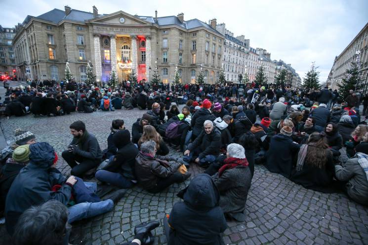 Hundreds of demonstrators gather in Paris for the opening of the 2017 One Planet Summit.