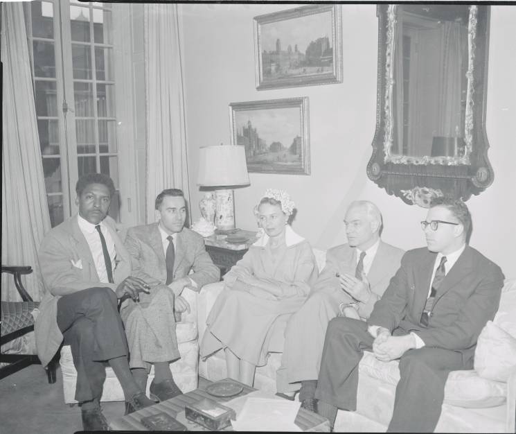 older photo of people sitting on a couch