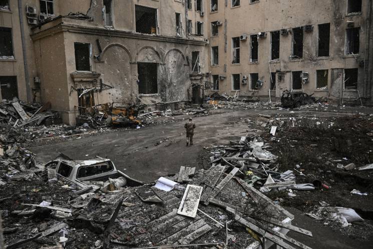  A Ukranian serviceman walks between rubble of the destroyed regional headquarters of kharkiv on March 27, 2022. 