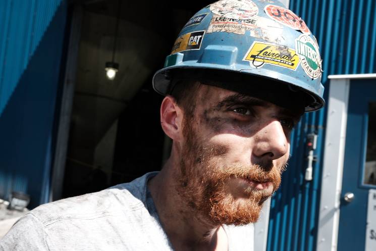 Coal worker Adam Burton pauses while working at a coal prep plant on May 19, 2017 outside the city of Welch, West Virginia. 