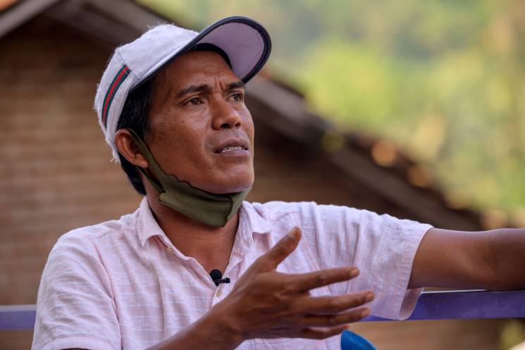 This photo taken on September 21, 2021 shows local villager Edi Suriana, who lives near the Suralaya coal power plant,