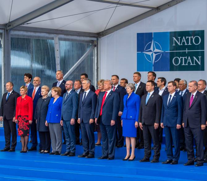 NATO Heads of State and Government stand for an official portrait.