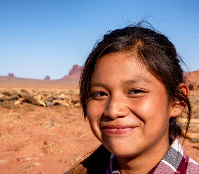 Outdoor Portrait of a beautiful Navajo Native American Indian Girl in the Northern Arizona Desert on the Monument Valley Indian Reservation; Getty