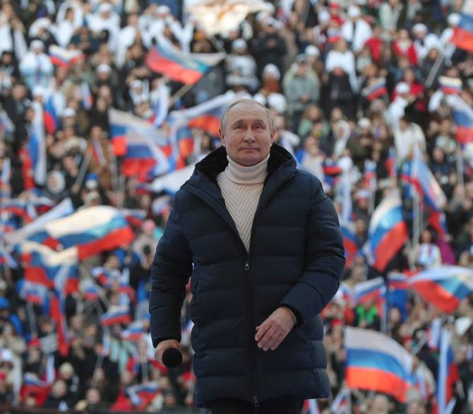 Russian President Vladimir Putin attends a concert marking the eighth anniversary of Russia's annexation of Crimea at the Luzhniki stadium in Moscow on March 18, 2022.; Getty Images