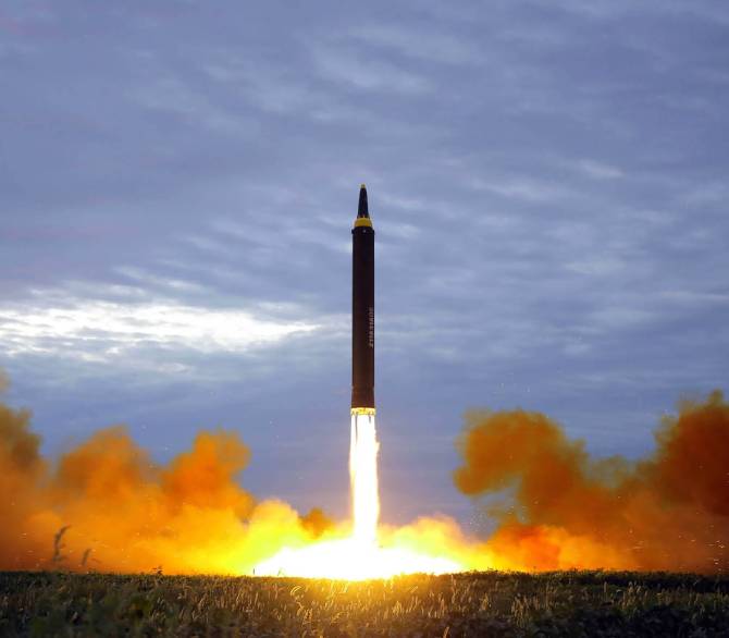 This picture from North Korea's official Korean Central News Agency (KCNA) taken on August 29, 2017 and released on August 30, 2017 shows North Korea's intermediate-range strategic ballistic rocket Hwasong-12 lifting off from the launching pad at an undisclosed location near Pyongyang.