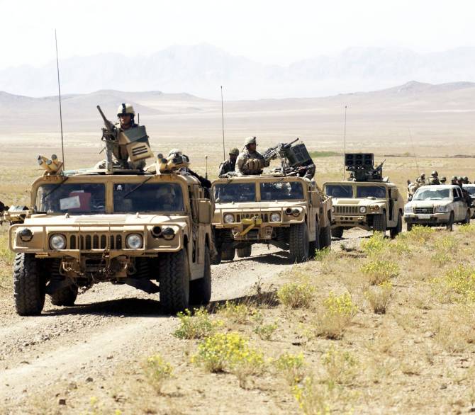 A U.S. Special Forces and Afghan National Army convoy rolls through the countryside on the way to conduct joint village searches with the Afghan National Army March 29, 2004 in southeast Afghanistan. 