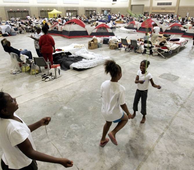 Displaced kids from New Orleans play in a gym in Baton Rouge