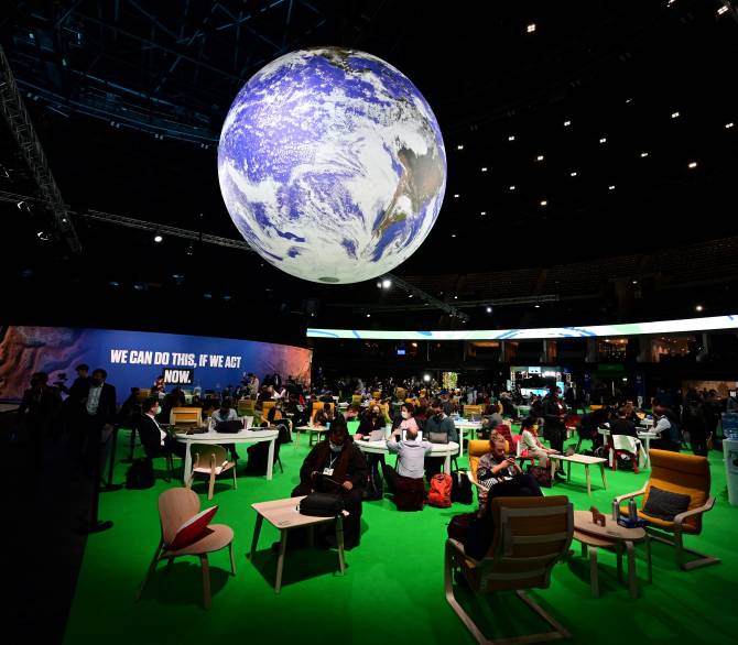 Delegates sit in the Action Zone as they attend the third day of the COP26 UN Climate Summit in Glasgow on November 3, 2021.