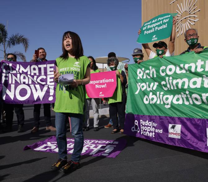 Activists demanding climate finance and debt relief for countries exposed to the effects of climate change protest at an impromptu demonstration at the UNFCCC COP27 climate conference on November 09, 2022 in Sharm El Sheikh, Egypt. 