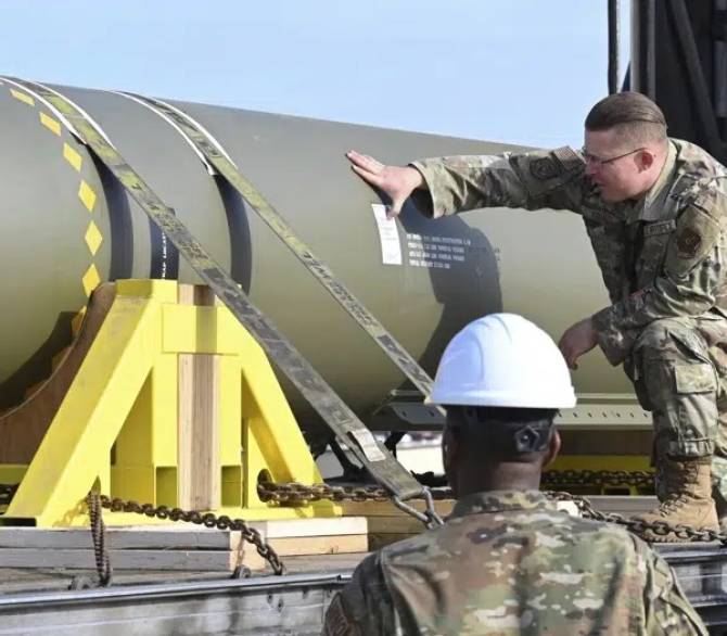 In this photo released by the U.S. Air Force on May 2, 2023, airmen look at a GBU-57, or the Massive Ordnance Penetrator bomb, at Whiteman Air Base in Missouri. That U.S. bomb, designed to destroy underground sites at the height of concerns a decade ago over Iran's nuclear program, has briefly reappeared amid new tensions with the Islamic Republic.