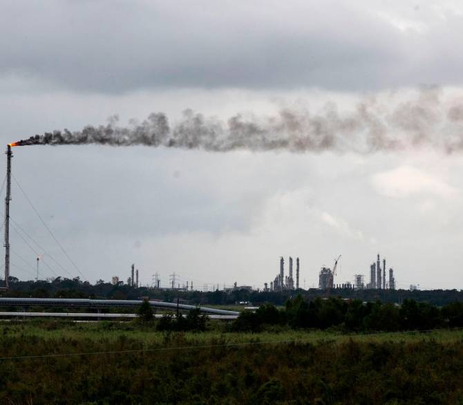 A gas flare in a Total oil refining plant is seen near Port Arthur, Texas, on August 28, 2020, one week after the region was hit by Hurricane Laura.