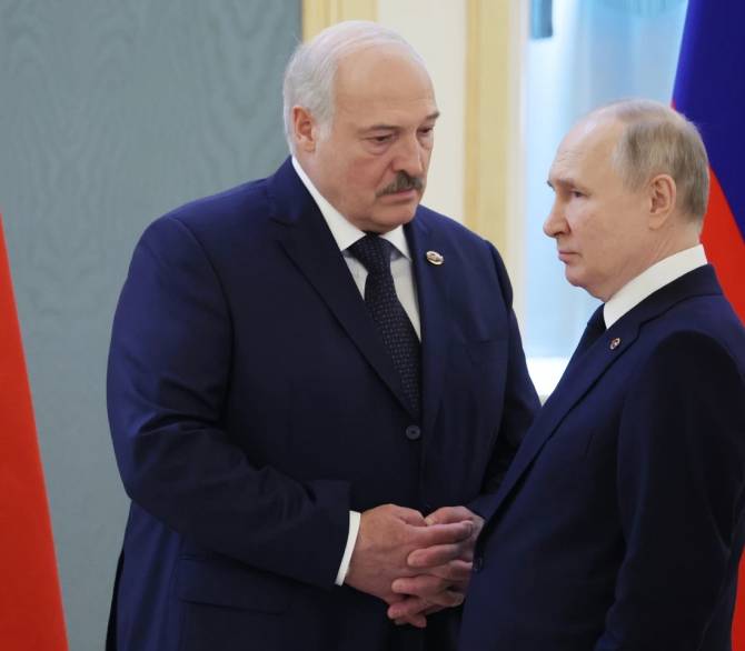 Belarusian President Alexander Lukashenko, left, and Russian President Vladimir Putin talk prior to the Supreme State Council of the Union State Russia-Belarus meeting in Mosco, Russia, April 6, 2023