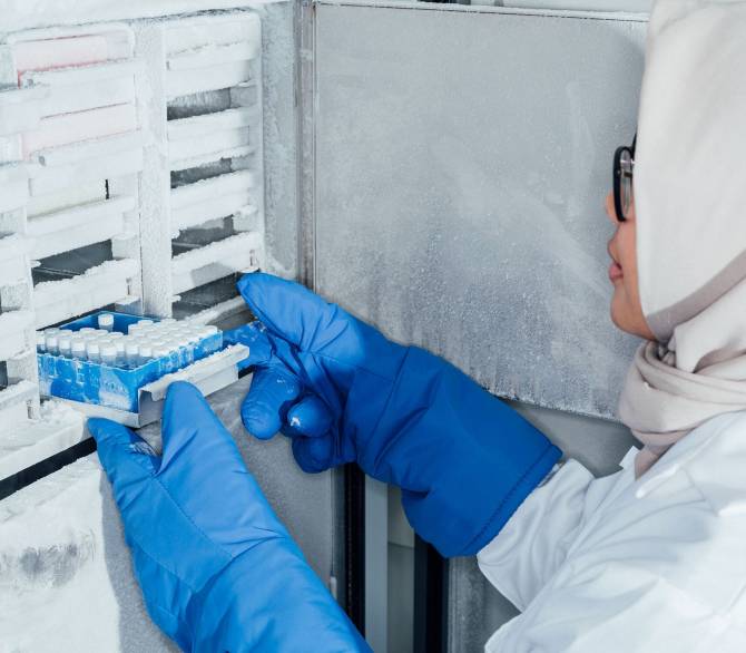 Maya Dibyana retrieves bacteria samples from the freezer at MicroHarvest.