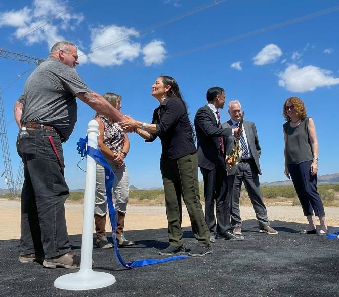Secretary of the Interior Deb Haaland (third from left) shakes hands with James Wynne from the International Brotherhood of Electrical Workers after the ribbon cutting for the Ten West Link on April 25. 