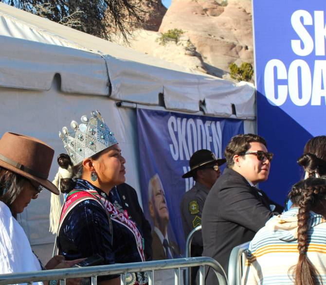 Miss Navajo Nation Ranisha Begay listens to remarks by Democratic vice presidential candidate Tim Walz during a campaign rally on Oct. 26 in Window Rock, Ariz.