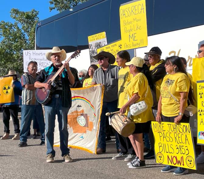 Supporters of the Radiation Exposure Compensation Act sing about saving the program on Sept. 22 before leaving Albuquerque, New Mexico for Washington, D.C. 