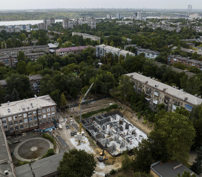 Construction workers dig out an underground school at gymnasium No. 71 in Zaporizhzhia, Ukraine, Aug. 30, 2024, one of a dozen planned for the city and designed to be radiation- and bomb-proof. 