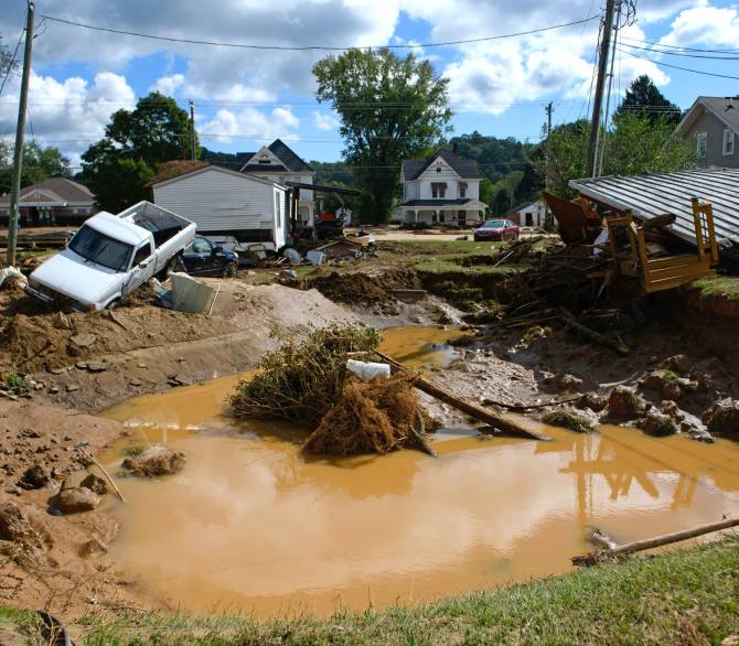 Damage and residual flooding is seen in the aftermath of Hurricane Helene on Sept. 29, 2024 in Old Fort, N.C., a community listed as disadvantaged by the Climate and Economic Justice Screening Tool. Credit: Melissa Sue Gerrits/Getty Images