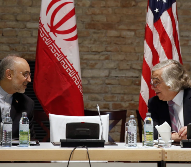 U.S. Secretary of Energy Ernest Moniz and Head of the Iranian Atomic Energy Organization Ali Akbar Salehi, left, meet at an hotel in Vienna, July 9, 2015. 