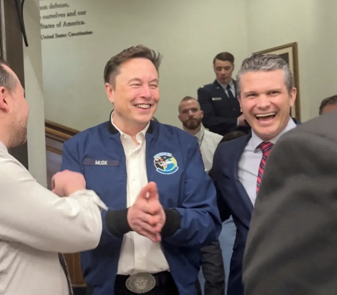 Elon Musk and U.S. Defense Secretary Pete Hegseth laugh at the Pentagon in Washington, D.C., U.S., March 21, 2025 in this screengrab obtained from a video.
