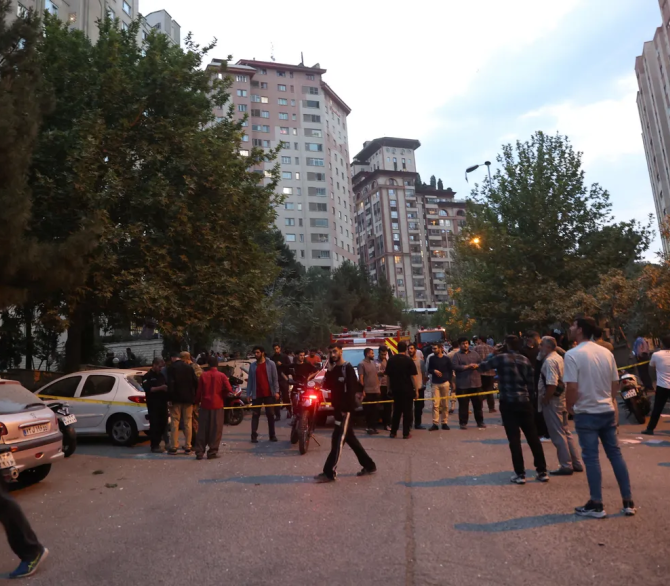 People gather in the street in the aftermath of Israeli strikes, in Tehran, Iran on June 13, 2025.