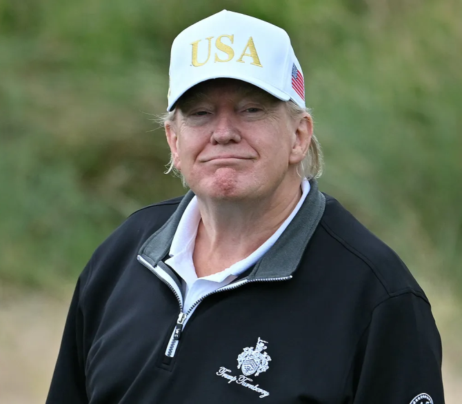 President Donald Trump reacts after playing from the first tee to officially open the Trump International Golf Links course in Balmedie, Aberdeenshire, north east Scotland on July 29, 2025.