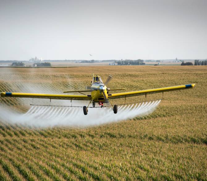 An Air Tractor sprays pesticides on a farm in Whittemore, Iowa. 