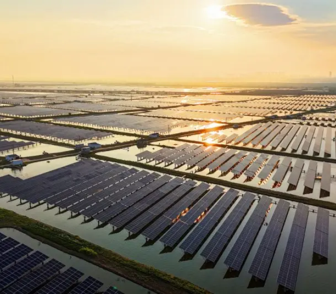 An aerial view shows solar panels at the fishing-solar complementary photovoltaic power generation base in Lianyungang, in eastern China's Jiangsu province on July 31, 2024. 