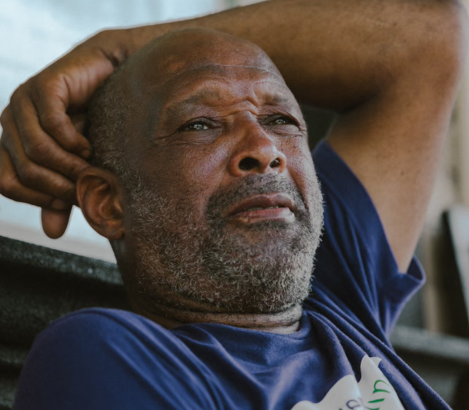 Darren McKinney, the field operations director of lowernine.org, takes a break during a shift repairing a neighbor’s home in New Orleans’s Lower Ninth Ward on 20 August 2025.