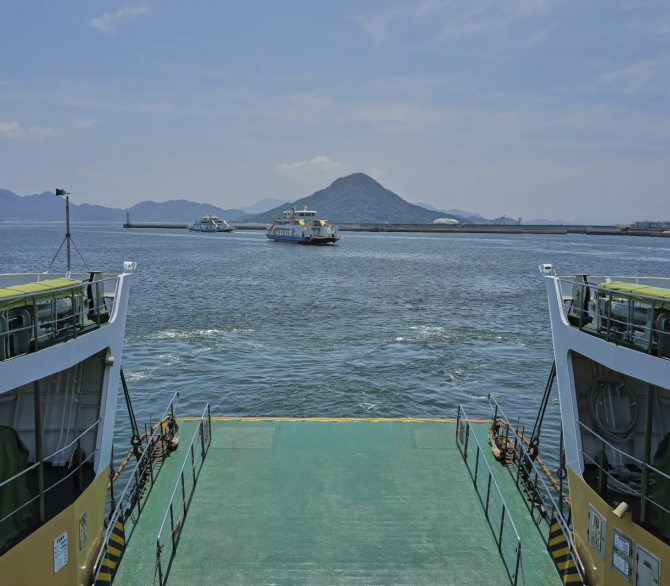 Ninoshima, an island where thousands of the dead and dying were brought after the first atomic bomb detonated 80 years ago, is seen from a ferry on Monday, July 7, 2025, in Hiroshima, western Japan. 