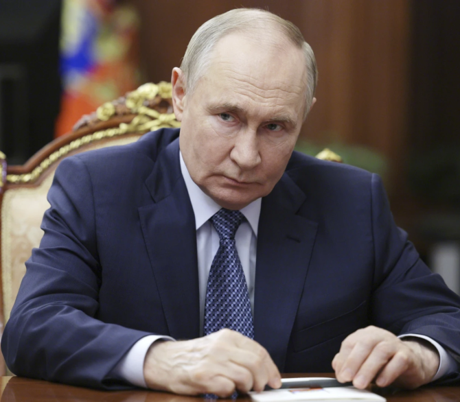 Russian President Vladimir Putin attends a meeting with Igor Shuvalov, the chairman of the Russian state development corporation VEB.RF, at the Kremlin in Moscow, Russia, Tuesday, Aug. 5, 2025.