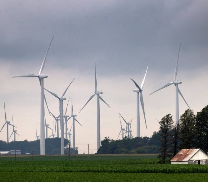 Wind turbines tower over a rural landscape on July 5 near Pomeroy, Iowa. Credit: Scott Olson/Getty Images