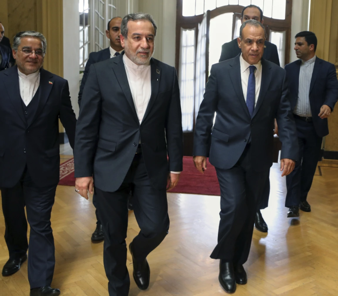 Egyptian Foregin Minister Badr Abdelatty, front right, accompanies his Iranian counterpart Abbas Araghchi, front, upon his arrival at Tahrir Palace in Cairo, Egypt, Tuesday, Sept. 9, 2025.