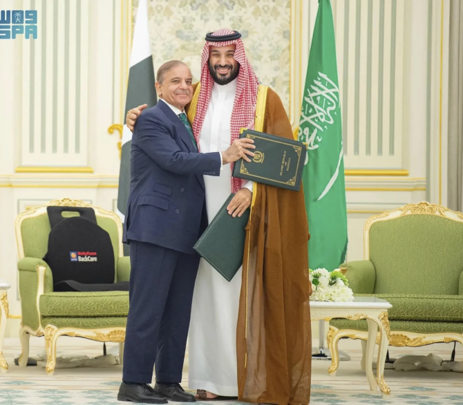This handout photograph released by the state-run Saudi Press Agency shows Pakistani Prime Minister Shehbaz Sharif, left, embracing Saudi Arabia’s Crown Prince Mohammed bin Salman after signing a joint defense pact in Riyadh, Saudi Arabia, Wednesday, Sept. 17, 2025. 