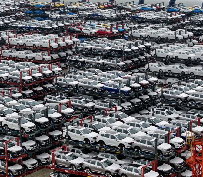 Electric cars for export stacked at the international container terminal of Taicang Port in Suzhou, in China's eastern Jiangsu Province in 2024. 