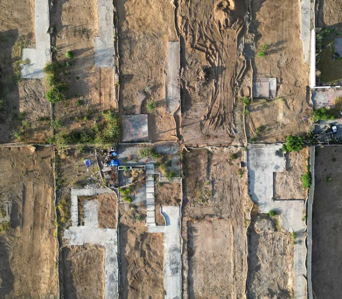 An aerial view of residential lots in Altadena, Calif., about six months after the Eaton Fire.